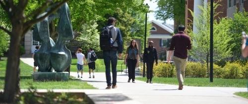 Diverse Centre students walking to class on a sunny day